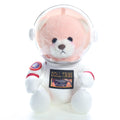 Urso astronauta rosa na embalagem, vista em ângulo