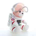 Urso astronauta rosa sentado, vista lateral com a mochila espacial